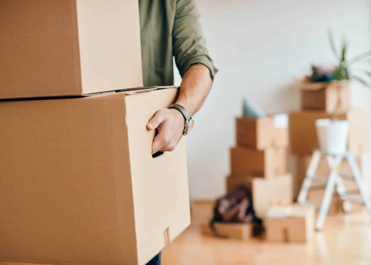 Man carries moving boxes