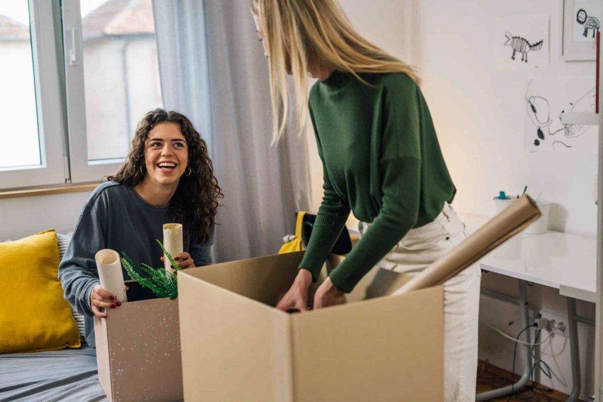 Students pack boxes ready to leave their accommodation