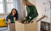 Students pack boxes ready to leave their accommodation