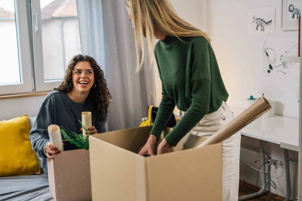 Students pack boxes ready to leave their accommodation